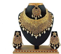 Shipping through UPS courier and delivery time 8-10 working days depending on the destination A DAZZLING AND AN EXQUISITE 4 PIECE NECKLACE- SET in White and gold color PERFECT FOR BRIDES AND FORMAL OCCASIONS It is hand crafted by skilled artisans of India . STUNNING PIECE TO WEAR FOR FORMAL OCCASIONS AND WEDDINGS A MUST HAVE FOR THE BRIDE TO BE You will seldom find such ethnic piece It will razzle and dazzle at any party where you wear it . Inspired by Sabyasachi Jewelry Beautifully elegant neck Pakistani Jewellery, Jodha Akbar, Sabyasachi Jewellery, Bollywood Wedding, Pakistani Jewelry, Women's Jewelry Sets, Jewellery Sets, Set Jewelry, Gold Necklace Set