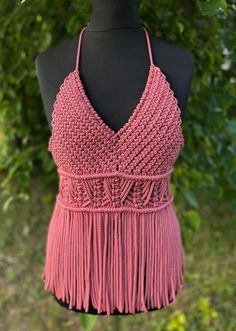 Handmade Macrame Top - a festival essential perfect for Valentine's Day, beach parties, and birthday celebrations. This pink boho-style top adds a touch of charm to your party wear, ensuring you stand out with style at every special occasion. Information: * Material: polyester cord. * Color: pink - ready to ship.  * Size: s-m  * Handmade by myself in Lithuania, Europe. * Size s-m in pink is ready to ship. For other sizes or other colors - please contact me by messages here on Etsy.  Care recommendations: hand-wash only with soup, no tumble dry, lay the garment out to dry on the flat surface, like a sofa, table or countertop. Shipping: ready to ship item will be dispatched in 1-3 business days. Made to order items may take additional 3-7 business depending on cord availability and your requ Summer Fringe Halter Top For Party, Summer Party Fringe Halter Top, Summer Party Halter Top With Fringe, Bohemian Triangle Top Halter For Party, Bohemian Crochet Halter Neck Top For Summer, Summer Fringe Halter Top, Beach Season Party Crochet Top, Bohemian Halter Neck Tops For Party, Handmade Crochet Top For Summer Beach Party