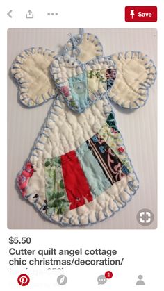 an appliqued baby's dress made out of fabric