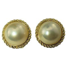 Vintage 14 Karat Yellow Gold and Pearl Earrings- These lovely earrings each feature one round pearl (14 mm) set in beautifully detailed 14K yellow gold. Omega back closures. Size: 18 mm Weight: 5.2 dwt. / 8.1 gr. Stamped: 20 14K 585 Very good condition, professionally polished. Will come packaged in a gift box or pouch (when possible) and will be shipped U.S. Priority Mail Insured. DV081522/17KCS Gold And Pearl Earrings, Gold Pearl Earrings, Lovely Earrings, Gold Pearl, Jewelry Earrings Studs, Priority Mail, Pearl Earrings, Jewelry Earrings, Yellow Gold