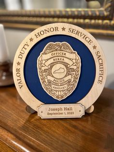 a police officer plaque on top of a wooden desk