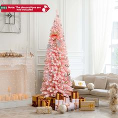 a pink christmas tree surrounded by presents