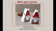 an origami christmas tree is shown in the shape of two gnomes, one with