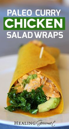 a chicken salad wrap on a plate with the words paleo curry chicken salad wraps