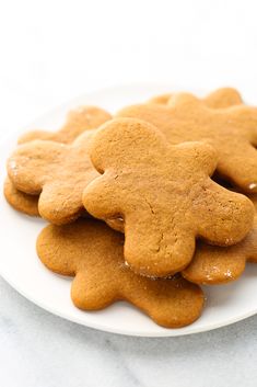 a white plate topped with cookies covered in icing