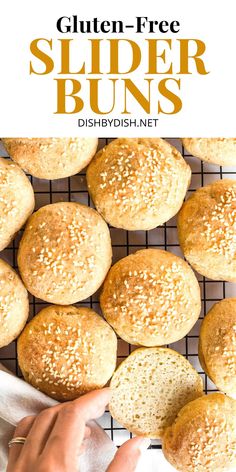 gluten - free slider buns on a cooling rack with sesame seeds