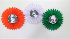 three paper fans with pictures of presidents on them