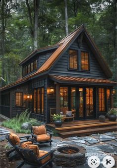 an image of a small cabin in the woods with chairs and fire pit on the patio