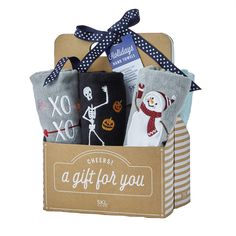 a gift box filled with socks that say,'give it for you'and an image of a skeleton