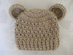 a crocheted bear hat on top of a table