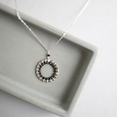 Free Shipping on our gorgeous, silver black spinel circle pendant necklace for women. Very lightweight and great for layering.  These are great graduation gifts, birthday gifts or bridesmaid gifts.- Black Spinel gemstones- Chain length can be adjusted from 16-18" with 2" extender chain- Spring ring clasp- Made in the USA in our New York City studio- Packaged with love and care in a gift boxMade of rhodium plated fine Italian silver. Stamped for authenticity. We use rhodium to resist tarnish and Modern Black Spinel Jewelry For Gifts, Minimalist Black Spinel Necklace As Gift, Nickel-free Black Necklaces For Anniversary, Silver Black Spinel Jewelry As Gift, Minimalist Silver Jewelry With Black Spinel, Silver Black Spinel Jewelry For Gift, Silver Black Spinel Jewelry Gift, Black Sterling Silver Necklace, Gift For Her, Black Sterling Silver Necklace For Her