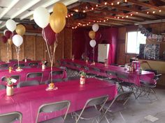 tables and chairs are set up with balloons