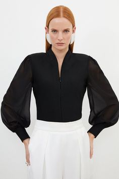 Experience Elevated Basics In A Knit Top, Featuring A Bodice That Hugs The Curves, And Sheer, Chiffon Sleeves With A Balloon Cut For A Playful Edge. The Zip Detail Makes For A Fully Customisable Fit, And Elevates This Piece Into A Day To Night Item, So Pair It With Tailored Trousers Or Jeans And Boots Or Strappy Heels For All Eventualities. Bandage Figure Form Zip Detail Chiffon Sleeve Knit Top High Quality, Soft Knit Fabric Statement, Floating Chiffon Sleeves Deep V Neckline Zip Front Accent Fi Sleeve Types And Styles, Hen Do Outfits, Workwear Capsule Wardrobe, Black Experience, Uniform Ideas, Plus Size Workwear, Spring Wedding Guest Dress, Ibiza Outfits, Chiffon Sleeves