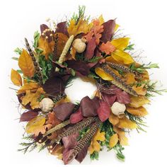 a wreath with autumn leaves and acorns