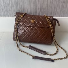 Brown Leather Chanel Crossbody Bag Classic Flap Bag With Removable Pouch For Shopping, Double Flap Satchel For Everyday Use, Classic Satchel Flap Bag For Shopping, Formal Brown Double Flap Shoulder Bag, Vintage Double Flap Shoulder Bag For Formal Occasions, Vintage Formal Shoulder Flap Bag, Brown Double Flap Formal Bag, Formal Brown Double Flap Bag, Vintage Brown Flap Bag For Evening