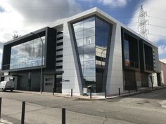 a large building sitting on the side of a road