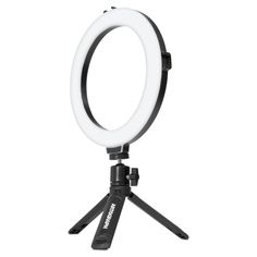 the ring light is on top of a tripod