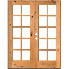 an open wooden door with glass panels on the front and side doors, which are made out of wood