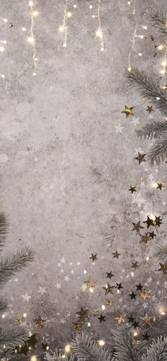 a christmas background with gold stars and tinsel