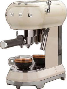 an espresso machine with two cups of coffee on the bottom and one in front