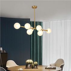 a dining room table with chairs and a chandelier hanging from the ceiling over it