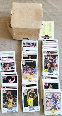 the basketball cards are stacked on top of each other