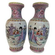 two vases that are decorated with people on them