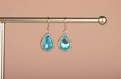 ~ Blue and green 2 tone glass crystal earrings, teardrop-shaped minimalistic earrings ~Great for everyday use as casual earrings also great for a party or evening ~ Gold plated ~ Earrings size: Earrings dangle length 1.9 cm, total length including ear hook 2.9 cm x width 1.2 cm approx. ~ Great essential piece with beautifully cut details ~ Ear hook is gold-plated, stainless steel ~ Lead and nickel free ~ We use high-quality jewellery (making) materials for sustainability (such as gold plated, st Hypoallergenic Teardrop Crystal Earrings For Party, Minimalistic Earrings, Earrings Classic, Casual Earrings, Minimal Earrings, Jewellery Making Materials, Le Crochet, Ear Hook, Gold Plated Earrings