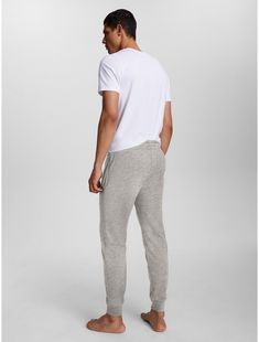 Tommy Hilfiger men's pant. Spun from soft, terry cotton with a comfortable elastic and drawstring waist, our loungewear jogger is the ideal choice for downtime.  Material: 60% Cotton. Cotton Sweatpants For Relaxation, Comfortable Cotton Sweatpants For Relaxation, Cotton Sweatpants With Ribbed Waistband For Relaxation, Cotton Sporty Joggers For Casual Wear, Sporty Cotton Joggers For Relaxation, Comfortable Relaxed Fit Sweatpants For Sleep, Comfortable Cotton Sweatpants For Sleep, Cotton Joggers With Ribbed Waistband For Relaxation, Sporty Cotton Sweatpants For Relaxation