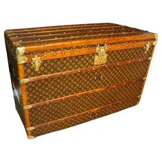 an old louis vuitton trunk is shown on a white background with clippings