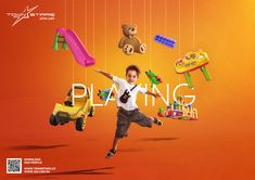 a young boy is jumping in the air with toys