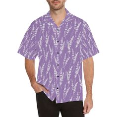 a man wearing a purple hawaiian shirt with white flowers on the front and chest, standing in