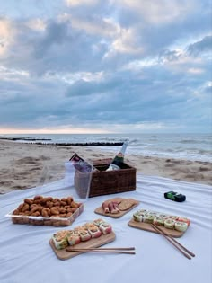 a table with food on it at the beach