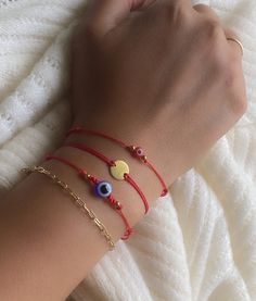 "Here is our size guide: Inches indicate circumference around wrist. - Small : 5\"-6\" - Medium : 7\"-8\" - Large: 9\"-10\" Red string of fate: Made with 18k gold plated charm. Non-tarnish and water resistant. 🇺🇸 Handmade to order in the U.S 💫 Non-tarnish, hypoallergenic gold beads. - Choose from the variety of colors from our other listings. - Premie-Toddler comes with looped ends by default . - Comes gift ready in a handcrafted card. The evil eye / mal de ojo / Nazar is a shield that guards Gold Evil Eye Bracelet With Sliding Knot As Gift, Red Evil Eye Bracelet, String Of Fate, Red Evil Eye, Red String Of Fate, Gold Arm Band, Bridesmaid Presents, Jet Stone, Red String