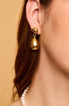 Light up everyday ensembles with these swinging drop earrings that beam with a high-polish finish. 1 1/2" drop Goldtone plate Imported Metal Long Drop Teardrop Earrings For Formal Occasions, Metal Drop Earrings With Polished Finish, Polished Metal Drop Earrings, Formal Long Drop Teardrop Metal Earrings, Brass Drop Earrings For Formal Occasions, Classic Teardrop Metal Clip-on Earrings, Polished Finish Drop Clip-on Earrings, Metal Jewelry With Shiny Teardrop Finish, Metal Teardrop Jewelry With Shiny Finish