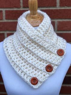 a white cowl with buttons on it