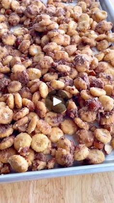 a pan filled with nuts on top of a wooden table