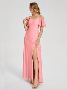 a woman in a long pink dress with one leg slited and the other side split open