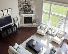 an aerial view of a living room with white furniture