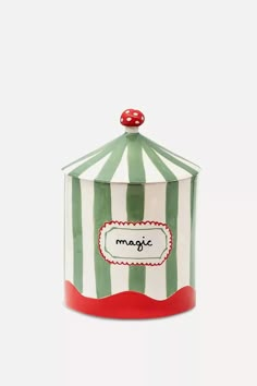 a green and white striped canister with a red polka dot on the top that says sugarman