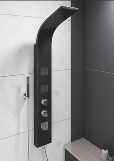 a black shower head with thermostaer and faucet mounted to it's side