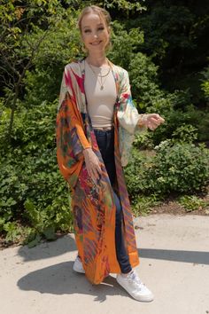 Our Multicolored Abstract Floral Kimono features traditional kimono sleeves with large floral motifs in black with bright blue outlining that drape when worn and displays a large, golden floral motif with abstract polychromatic designs running through it on the backside. The flowy, relaxed fit of the kimono and the lightweight, breathable, and silky feel will easily make this your go-to kimono. Material: Viscose Satin Body Length Hps to Hem: 53 1/2" Sleeve Length: 13" Armhole Straight: 13 1/2" S Traditional Kimono, Satin Kimono, Kimono Sleeves, Indian Embroidery, Fashion Marketing, Dark Orange, Floral Kimono, Kimono Sleeve, Modern Floral