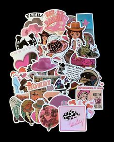 various stickers and decals are arranged on a black surface, including one with a cowboy hat