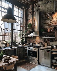 an industrial style kitchen with brick walls and stainless steel appliances, potted plants on the counter