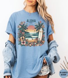 Discover our Hawaii Aloha Vintage Comfort Colors shirt! This cute t-shirt features an eye-catching design with a vintage graphic of a tropical island and retro sunset. Made of 100% ring-spun ethically grown cotton, this shirt is super soft and comfortable. It has a relaxed fit which is made of a medium fabric that is preshrunk. Looks super cute with shorts or jeans and throw a cardigan on top for that cooler evening.Size up 1-3 sizes for an oversized beach coverup. Great gift for a BeachLover! Comes in 13 pretty colors! 💠PRINT: This is a handmade, Direct-to-Garment printed item. The designs are professionally printed directly on to the shirt. All over printing is used. The ink is printed directly into the fabric. ✦Images may sometimes appear larger in the photo than in person due to image Hawaiian Graphic Print Beach Season Shirt, Tropical Printed Tops For Surfing, Tropical Printed Tops For Resortwear, Summer Hawaiian Shirt With Graphic Print For Surfing, Casual Hawaiian Shirt With Graphic Print For Surfing, Hawaiian Style Top With Sublimation Print And Relaxed Fit, Vintage Printed T-shirt For Vacation, Graphic Print Hawaiian Shirt For Surfing, Graphic Print Short Sleeve Hawaiian Shirt For Surfing