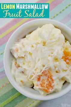 lemon marshmallow fruit salad in a white bowl on a colorful towel with text overlay