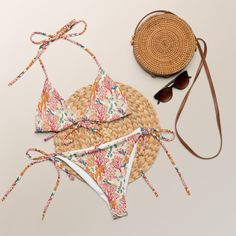 Stay comfortable and stylish all summer with our Coral Garden EcoWave String Bikini Set, featuring a unique coral reef pattern. Designed with sustainability in mind, this bikini is made from soft recycled polyester and features double-layering for added durability. The UPF 50+ protection ensures you can enjoy outdoor activities without worrying about harmful UV rays. With multiple ways to tie and style the straps, you can customize your look for a perfect fit. Whether you're swimming, sunbathing, or just relaxing at the beach, this bikini is your go-to choice for eco-friendly swimwear. The bikini top comes with removable padding for personalized comfort, and the soft, stretchy material ensures a flattering fit for all body types. Available in sizes up to 6XL, this bikini caters to everyone Coral Swimwear For Summer Pool Time, Coral Swimwear For Summer Pool Season, Coral Swimwear For Beach Season, Coral Beachwear Swimwear, Coral Swimwear For Poolside, Coral Beachwear Swimwear For Summer, Coral Beachwear For Poolside, Coral Beachwear Swimwear For Pool, Coral Summer Swimwear For Poolside