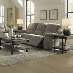 a living room with two couches and a coffee table