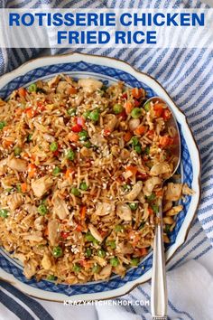 chicken fried rice on a blue and white plate with silverware in front of it