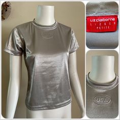 For your consideration Vintage Liz Claiborne metallic silver top. Embossed USA logo. Poly nylon Lycra spandex blend. Made in USA. Marked PETITE SMALL Fits like a modern women's XS/S Pre owned, shows general wear. Overall great shirt. Does show minor snags and surface wear throughout. The bottom hem has a small area where the stitch is missing, but it still wears fine. Please review photos to best determine condition and message with any questions. Zoom for details. Shown on size small mannequin Babydoll Tee, Silver Shirt, Small Mannequin, 90s Party, Silver Top, Silver Tops, Liz Claiborne, Emboss, Modern Woman